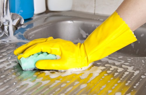 Professional cleaning of kitchen and bathroom surfaces in a Notting Hill flat