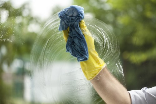 Professional cleaners wiping dust from surfaces after renovation in Nottinghill
